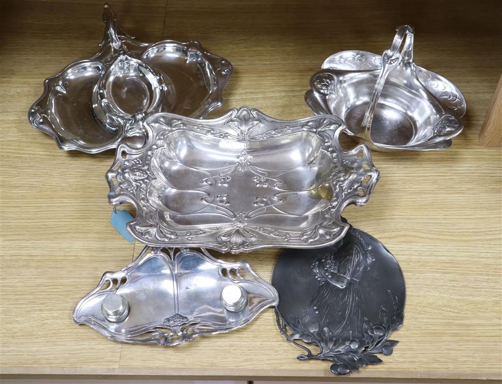 A WMF inkstand, 26cm wide, WMF plaque embossed with a young girl, and three Art Nouveau silver plated serving dishes (5)
